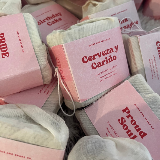 Handcrafted soap bars with visible branding in a pile